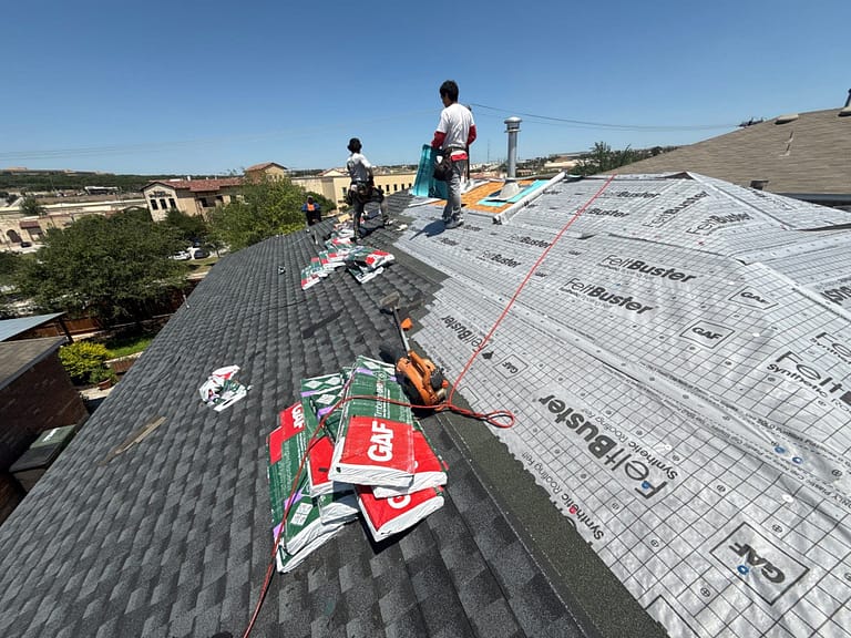 BH Roofing crew installing GAF Timberline shingles over FeltBuster synthetic underlayment on a San Antonio roof replacement